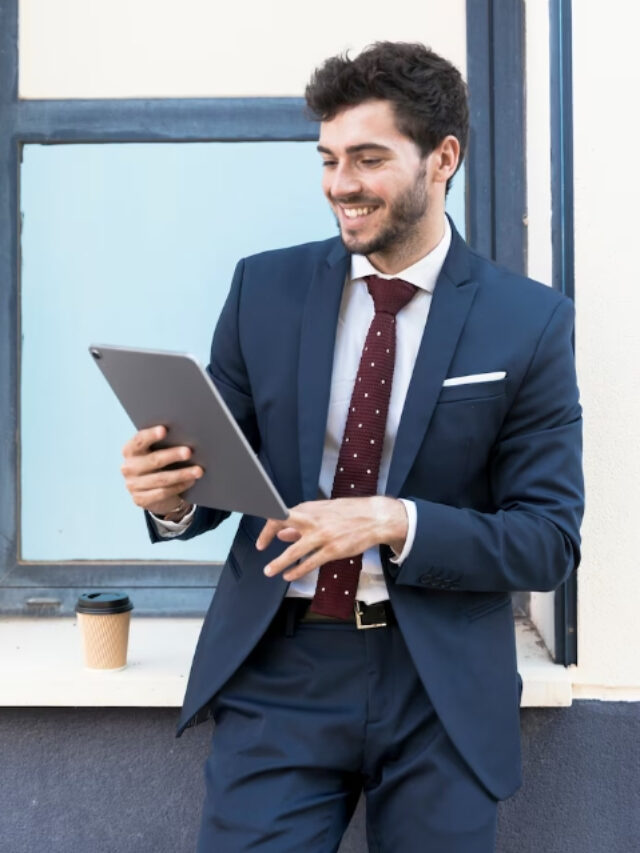 medium shot smiley man looking at a tablet